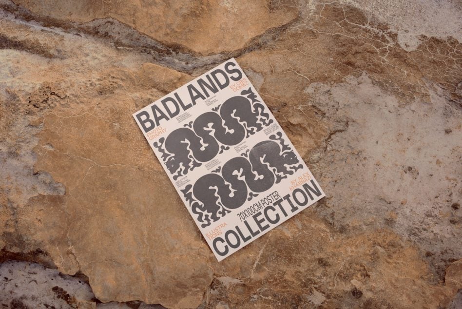 Badlands poster with wavy black design on cracked stone ground